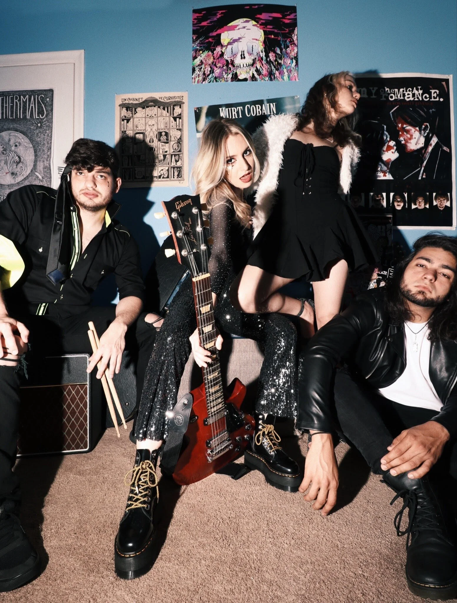   Pictured, from left to right: drummer Juan Cabrera, lead singer and guitarist Liz Varnum, bassist Paula Bunich, and guitarist Nelson Gonzalez.  